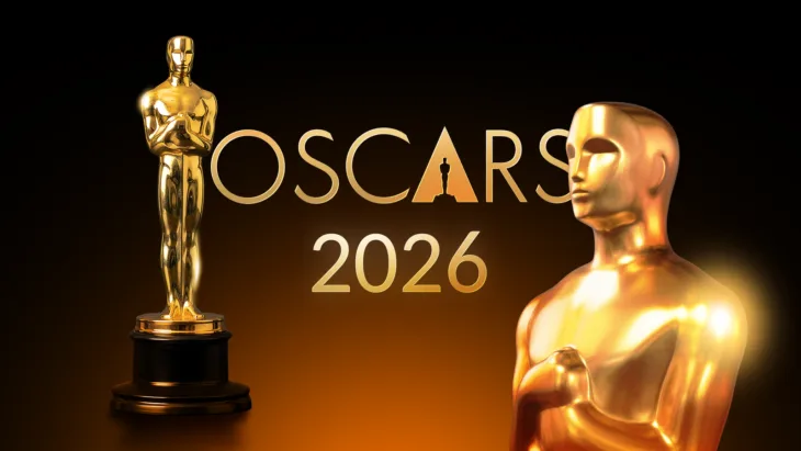 Gold oscar statuettes with the oscars 2026 logo on a dark background with a warm glow