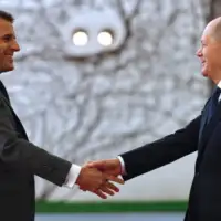 Emanuel Macron Olaf Sholz EPA