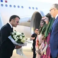 Macron i turski ministar Vedat Isikhan  nato samit