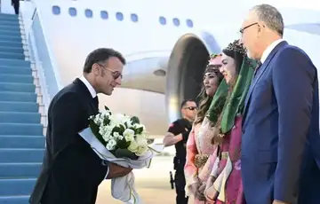 Macron i turski ministar Vedat Isikhan  nato samit